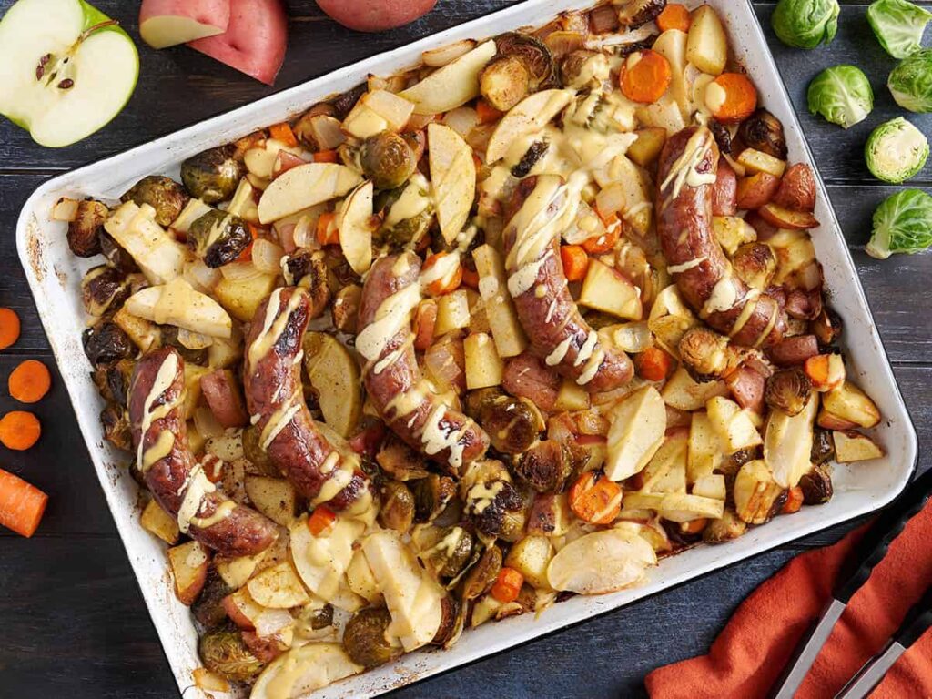 Overhead view of Oktoberfest sheet pan brats.