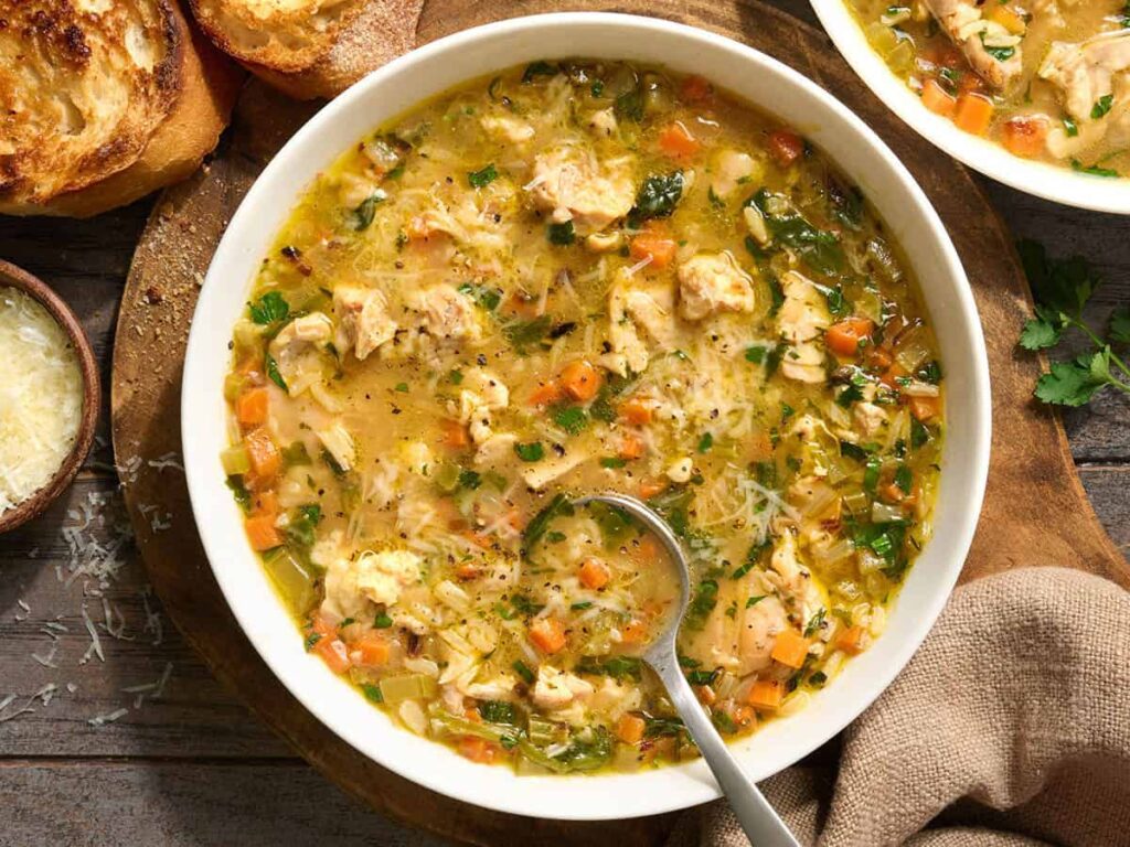Overhead view of a chicken brothy rice bowl.