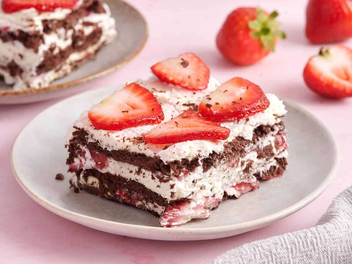 Side view of a slice of chocolate strawberry icebox cake.
